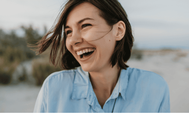 smiling-portrait-candid-laughing-woman-beach (1)